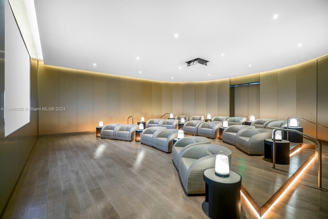 home theater room featuring light hardwood / wood-style flooring