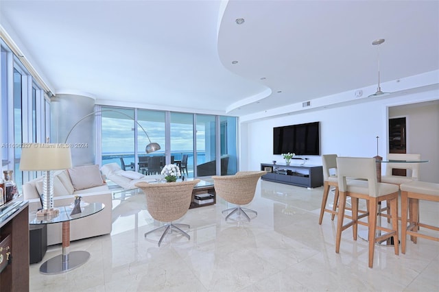 living room with floor to ceiling windows