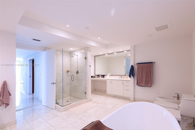 bathroom featuring separate shower and tub, a bidet, and vanity