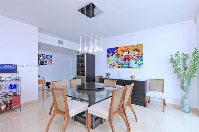 dining space with light tile patterned floors