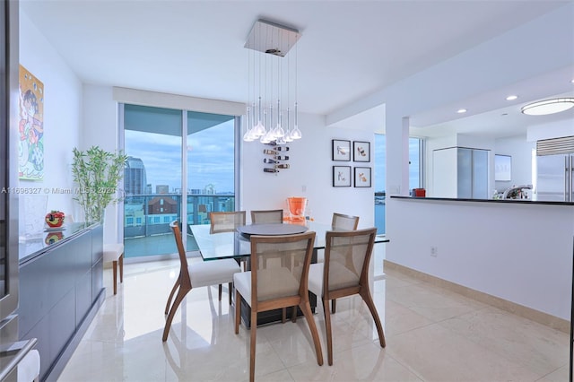 dining space with an inviting chandelier