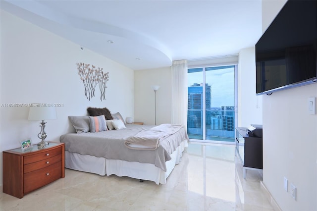 bedroom with access to outside and floor to ceiling windows