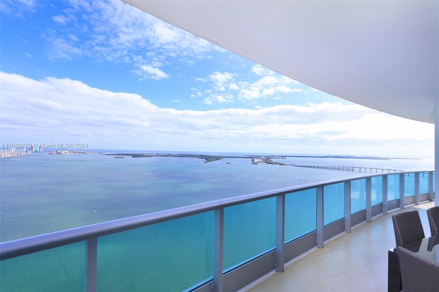 balcony featuring a water view