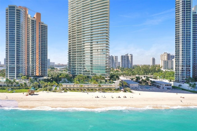 exterior space featuring a water view and a view of the beach