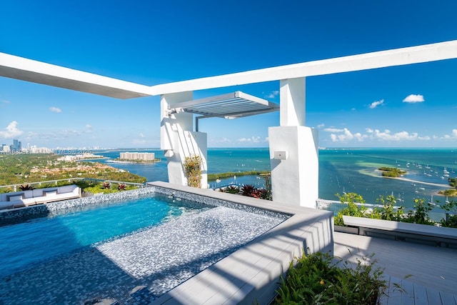 2627 S Bayshore Dr Unit 3201, Miami, FL 33133 - view of swimming pool featuring a water view, a swimming pool, and an outdoor living space