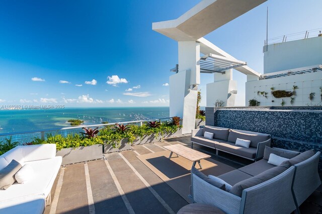 2627 S Bayshore Dr Unit 3201, Miami, FL 33133 - view of patio with a water view and an outdoor living space