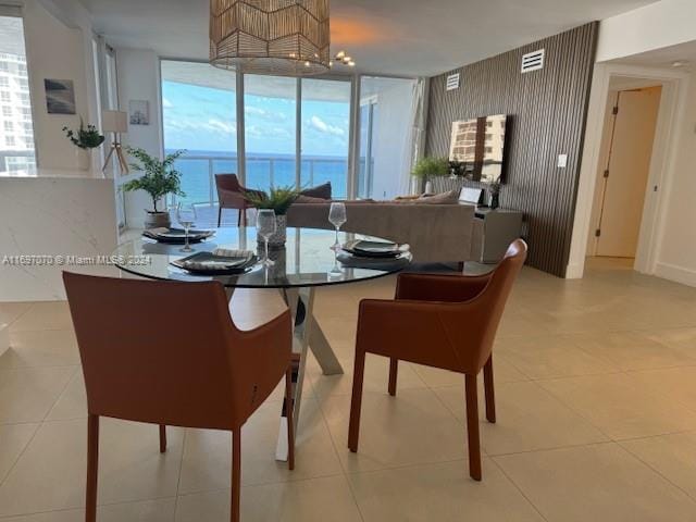 dining space with plenty of natural light and light tile patterned flooring