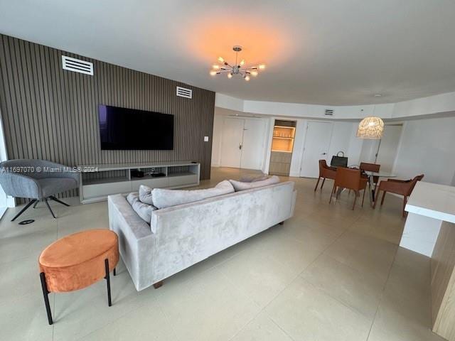 living room with a notable chandelier