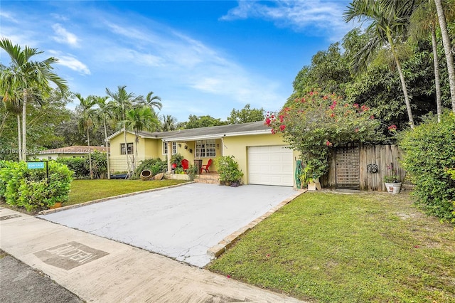 single story home with a front lawn and a garage