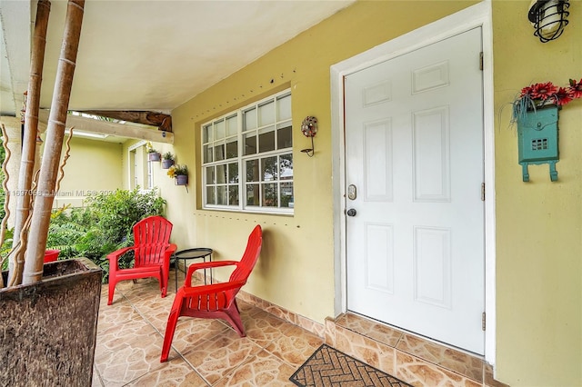 property entrance with covered porch