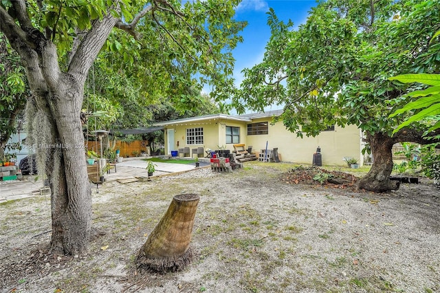 rear view of property with a patio