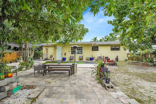 rear view of property with a patio area