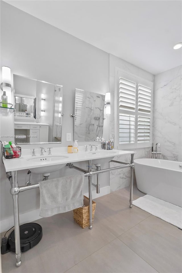 bathroom featuring tile walls, sink, tile patterned floors, and shower with separate bathtub