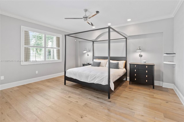 bedroom with crown molding, ceiling fan, and light hardwood / wood-style floors