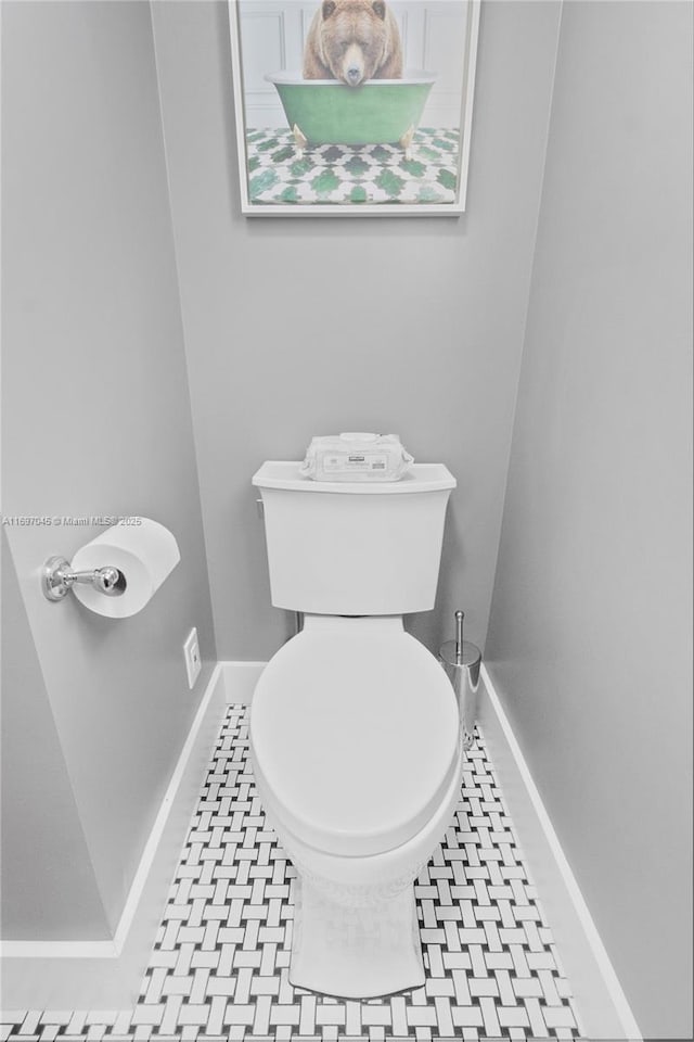 bathroom with tile patterned floors and toilet