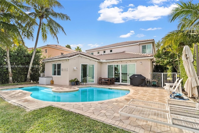 rear view of property with a patio area