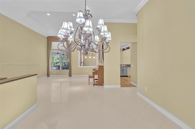 unfurnished dining area with a chandelier and ornamental molding