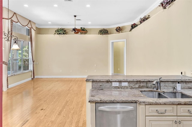 kitchen with dishwasher, sink, light stone countertops, light wood-type flooring, and white cabinetry