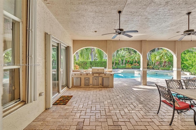 view of patio / terrace with ceiling fan and area for grilling