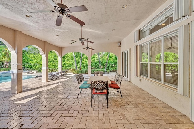 view of patio featuring ceiling fan