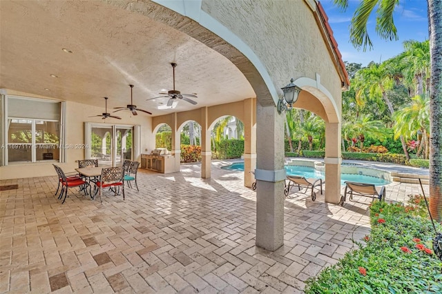 view of patio / terrace featuring ceiling fan