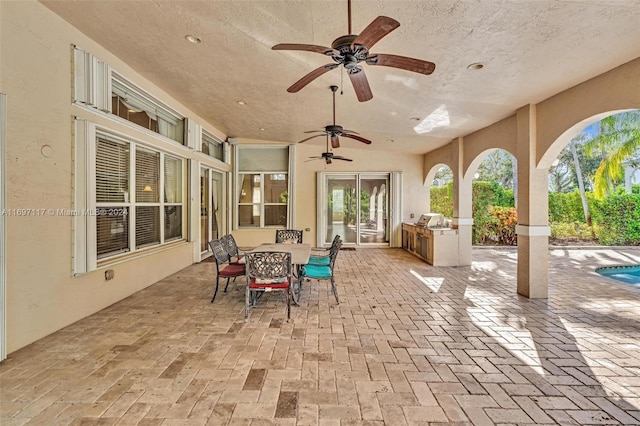 view of patio / terrace with area for grilling and ceiling fan