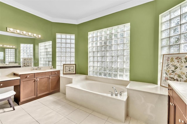 bathroom with a washtub, vanity, tile patterned floors, and crown molding