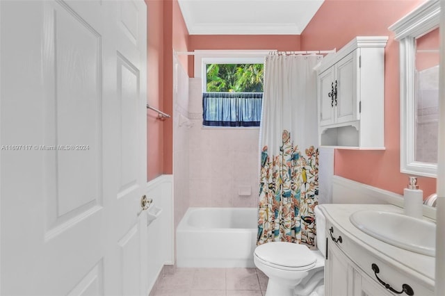 full bathroom featuring shower / tub combo, tile patterned floors, vanity, crown molding, and toilet