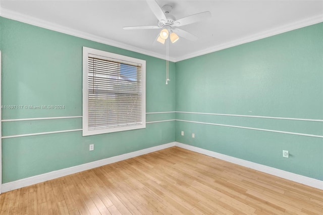 spare room with light hardwood / wood-style flooring, ceiling fan, and crown molding