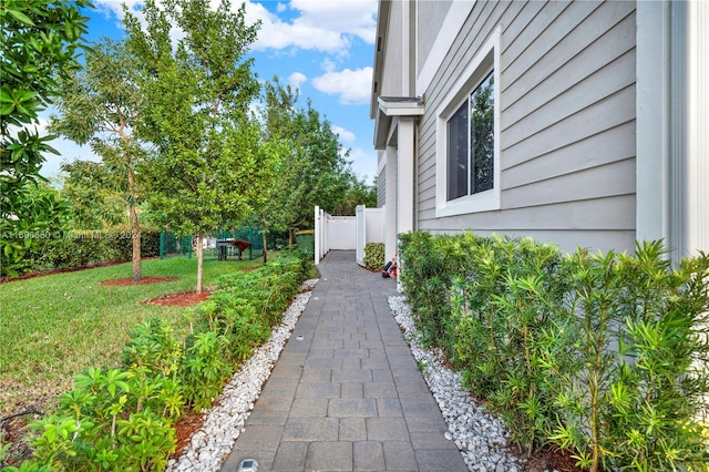 view of side of property with a yard