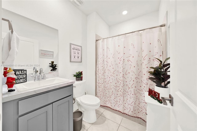 bathroom featuring tile patterned floors, vanity, and toilet