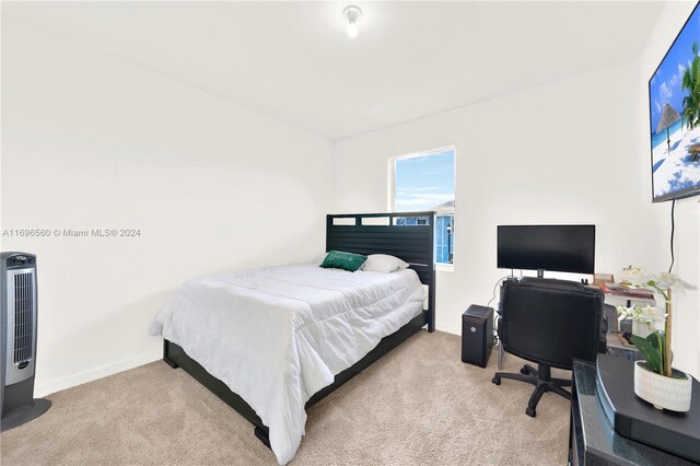 1707 SE 9th Ter, Homestead, FL 33034 - carpeted bedroom with an office area and baseboards