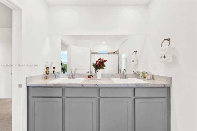 bathroom featuring vanity and walk in shower