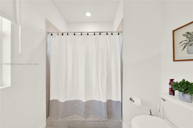 1707 SE 9th Ter, Homestead, FL 33034 - bathroom featuring toilet and a shower with shower curtain