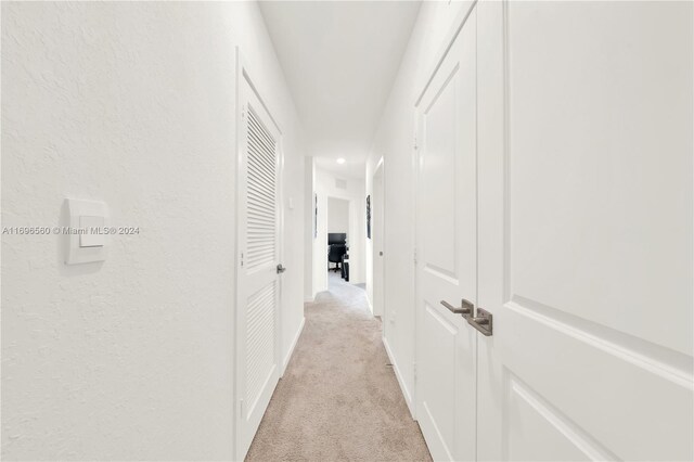 1707 SE 9th Ter, Homestead, FL 33034 - hallway featuring light carpet, a textured wall, recessed lighting, and baseboards