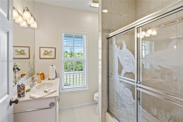 full bathroom featuring tile patterned flooring, vanity, toilet, and enclosed tub / shower combo