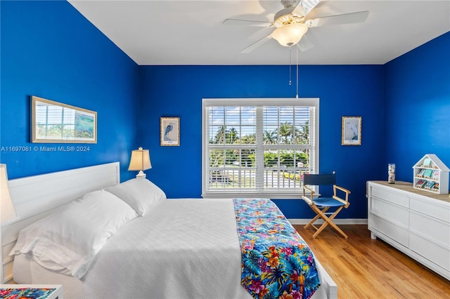 bedroom featuring ceiling fan and light hardwood / wood-style floors