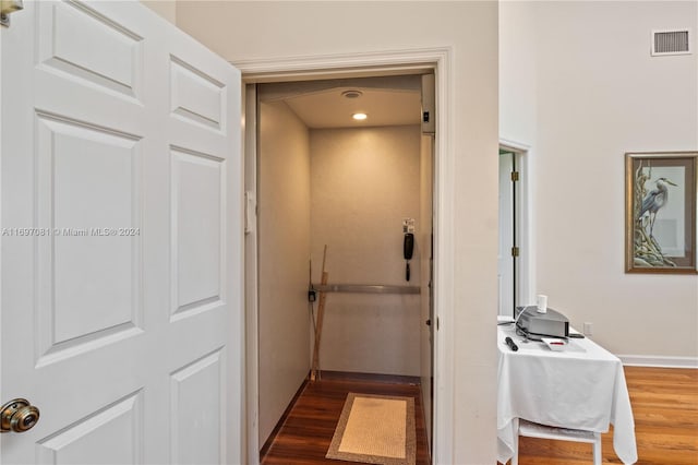 corridor with dark wood-type flooring