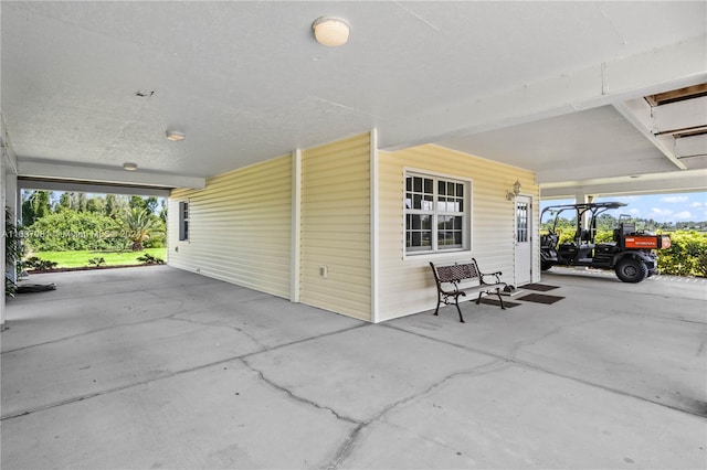 view of patio / terrace with a carport