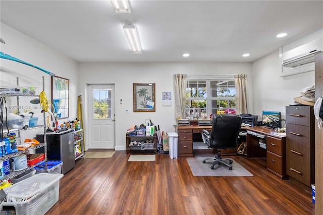 office space with a wealth of natural light, dark wood-type flooring, and a wall mounted air conditioner