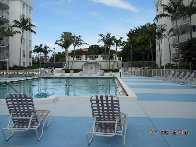 498 NW 165th St Rd Unit D-607, Miami, FL 33169 - community pool with a patio area