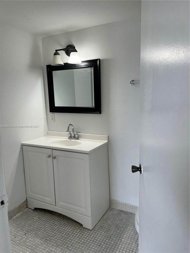 498 NW 165th St Rd Unit D-607, Miami, FL 33169 - bathroom featuring vanity, baseboards, and tile patterned floors