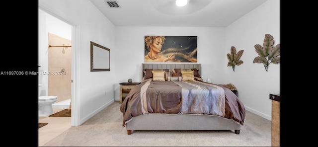 carpeted bedroom featuring connected bathroom