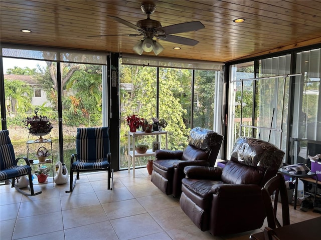 sunroom with wooden ceiling and ceiling fan