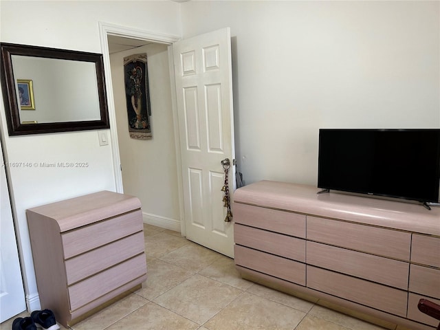 bedroom featuring light tile patterned flooring