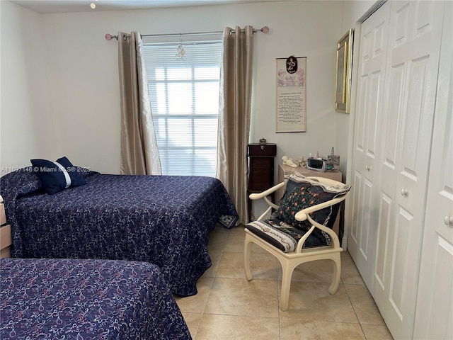 bedroom featuring light tile patterned floors