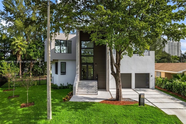 modern home with a front lawn and a garage