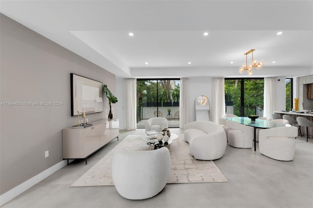 living room with a chandelier and a healthy amount of sunlight