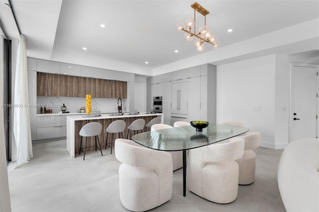 dining area featuring an inviting chandelier