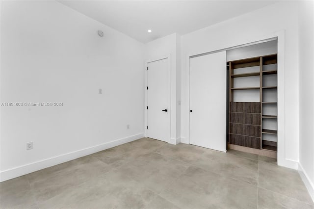 unfurnished bedroom with a closet